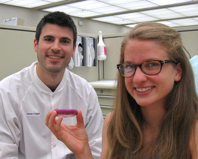 Dental student shows the mouth guard made for her at last year's Mouth Guard Clinic.